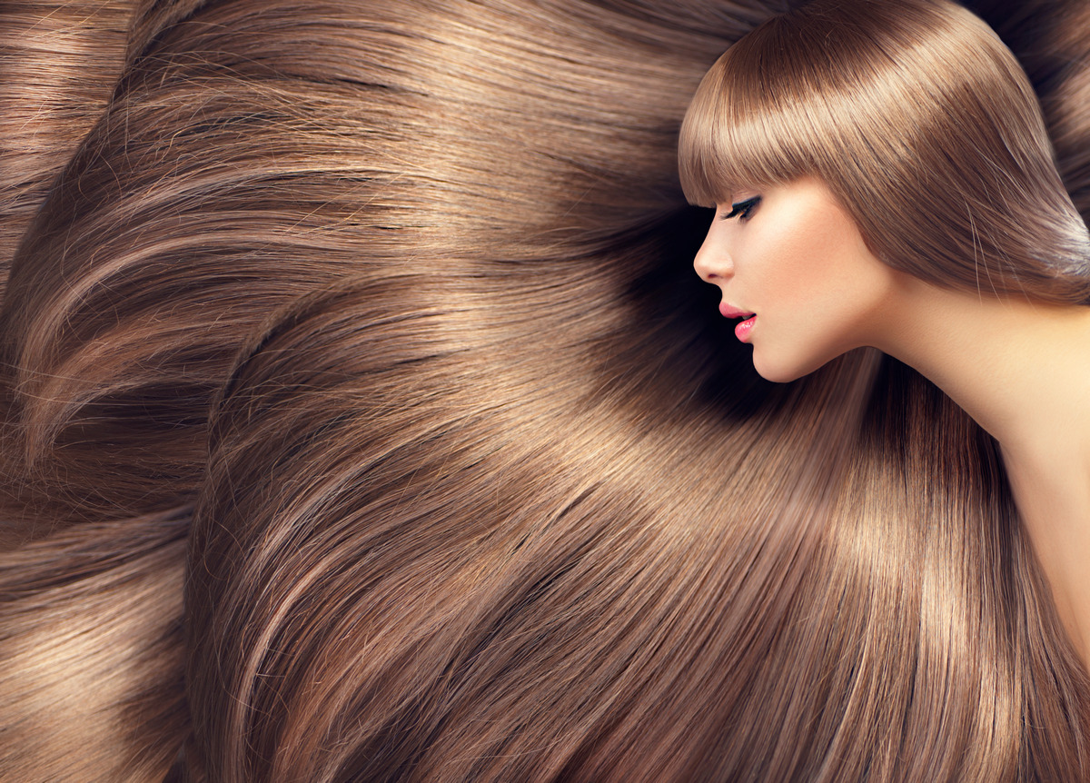 The length and texture of the girl's blonde hair
