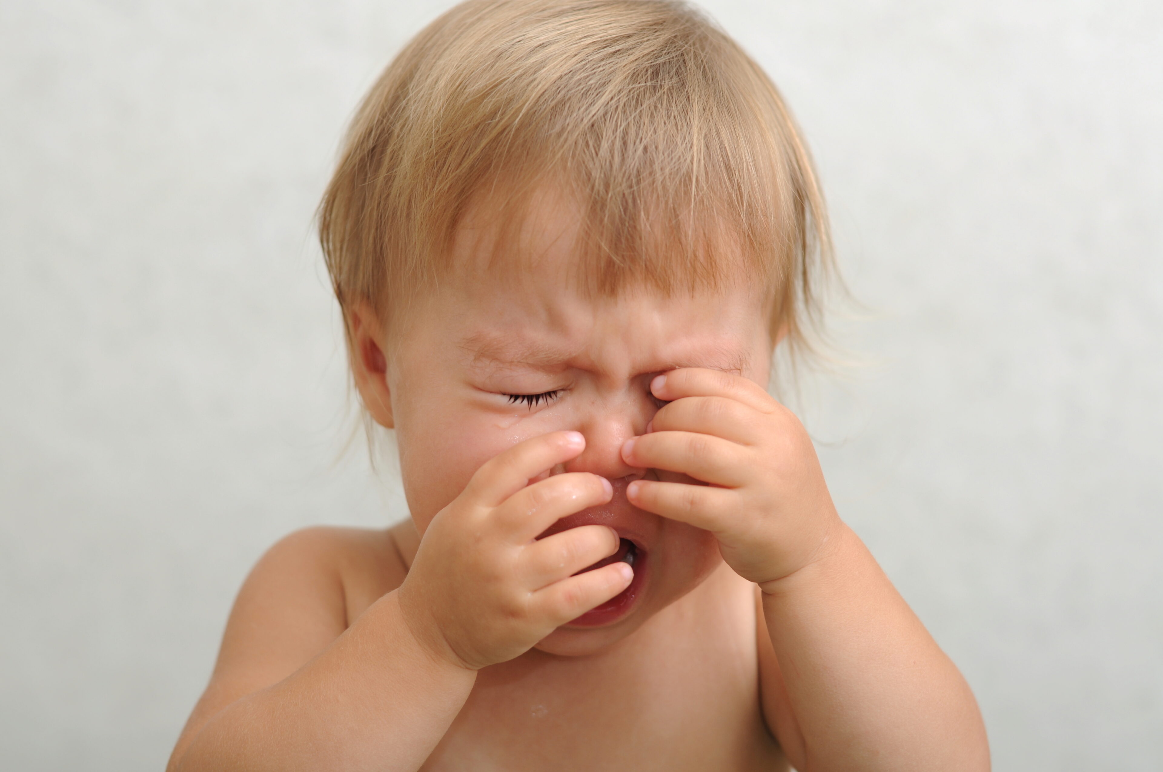 Baby is crying when his eye is uncomfortable