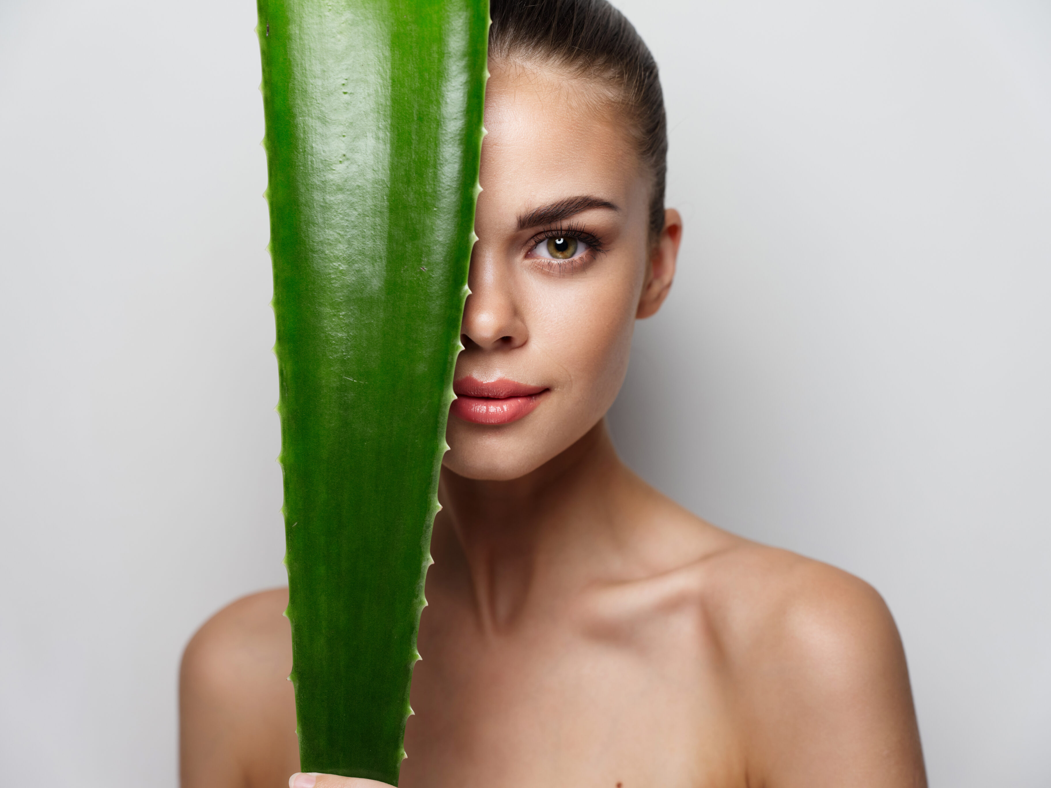 A woman with green aloe leaf