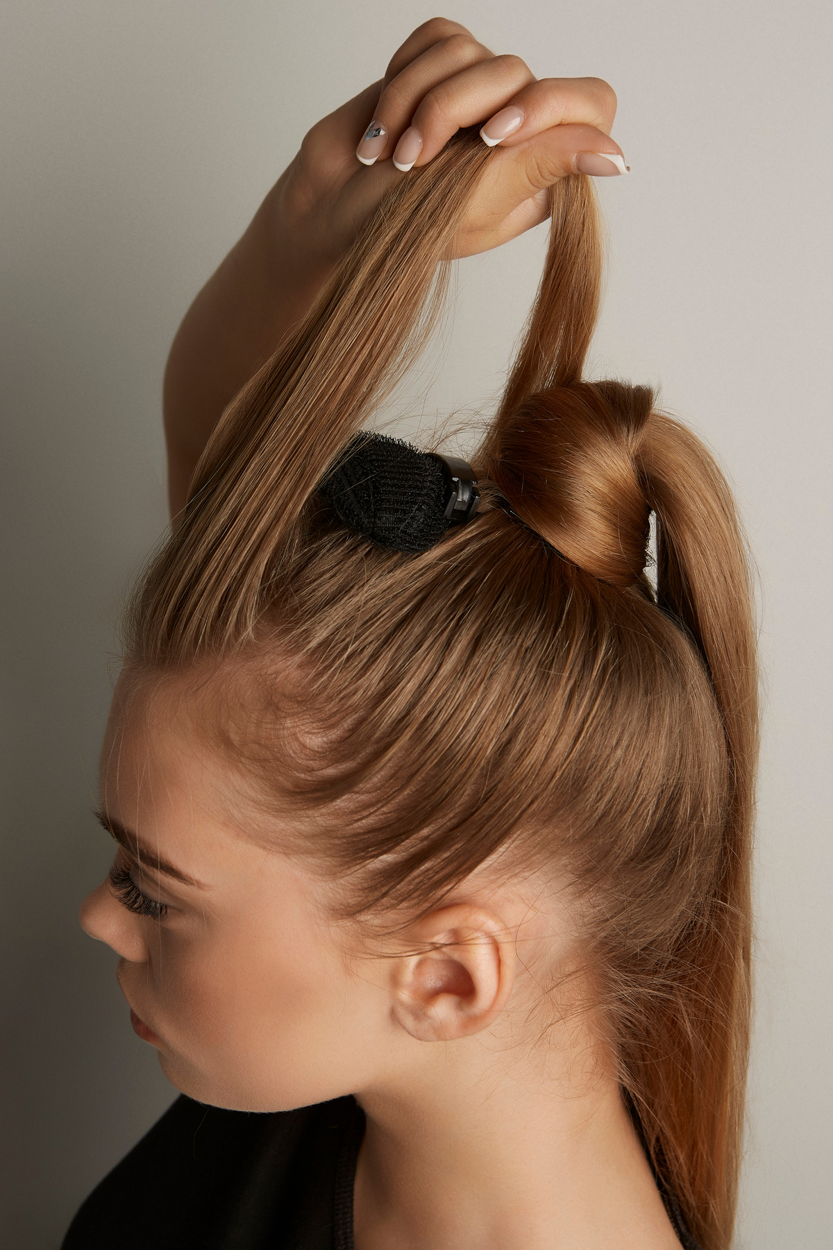Wrap A Thin Strand Of Hair Around The Base Of The Ponytail