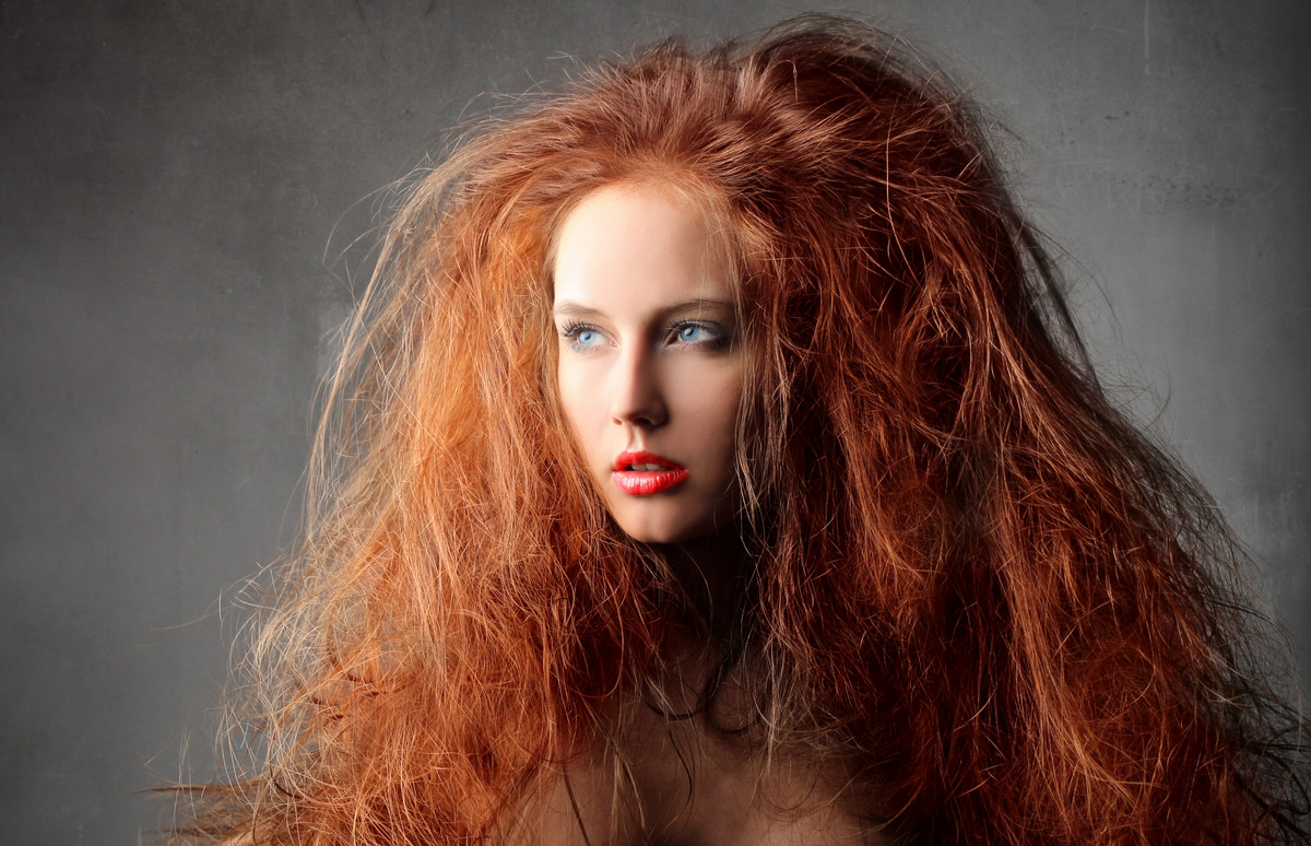 Young attractive woman with red hair 