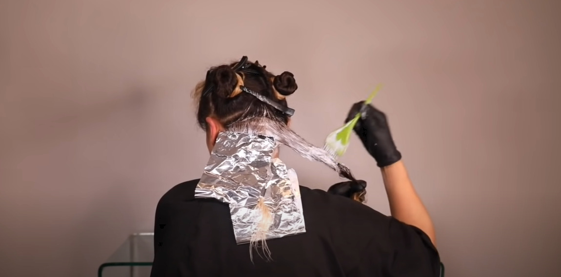 Applying the bleaching mixture to your hair section by section