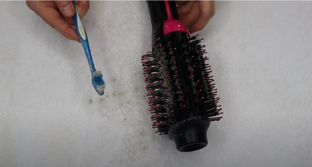 Continue scrubbing the bristles