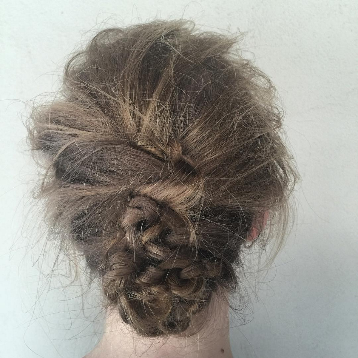 Knotted Updo With Flyaways
