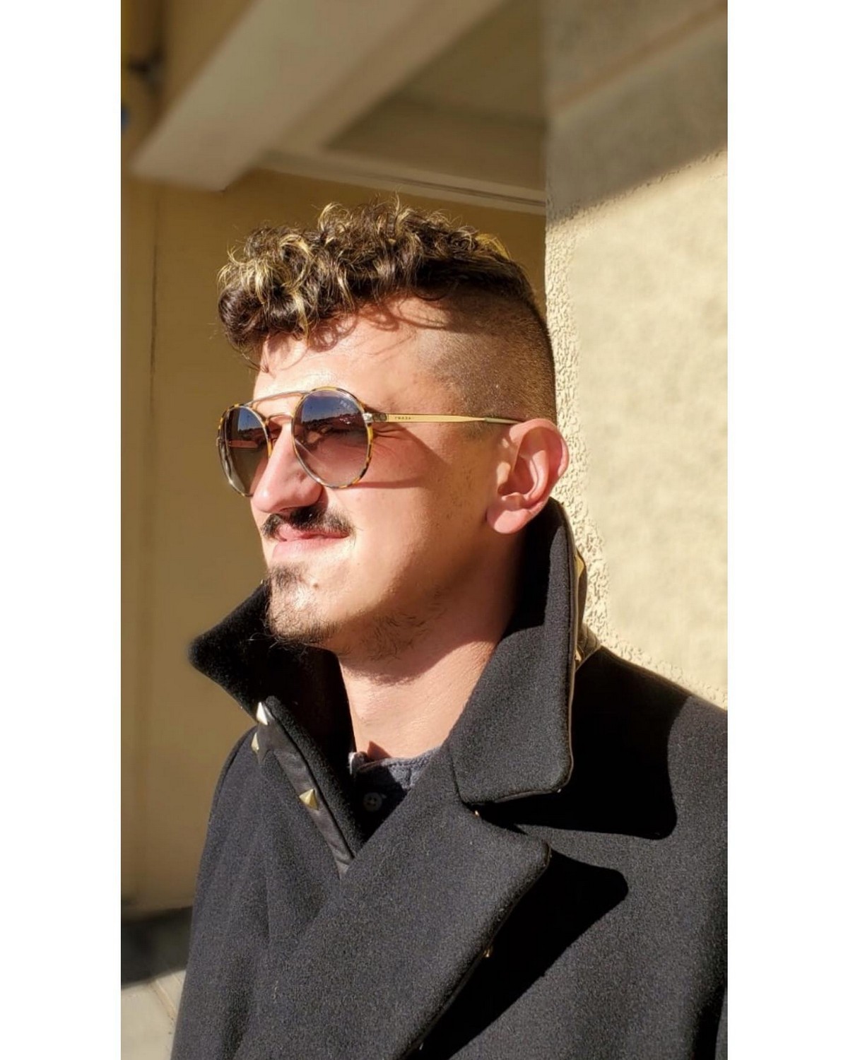 Curly Top With Blonde Highlights