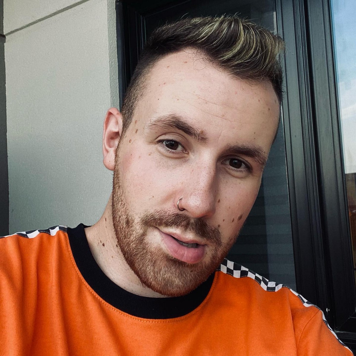 Short Faux Hawk Haircut With Blonde Highlights