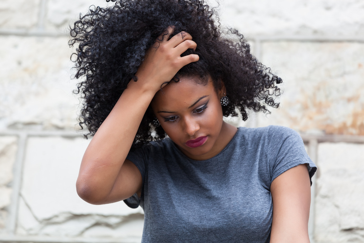 A young woman is worrying about her rat nest hair