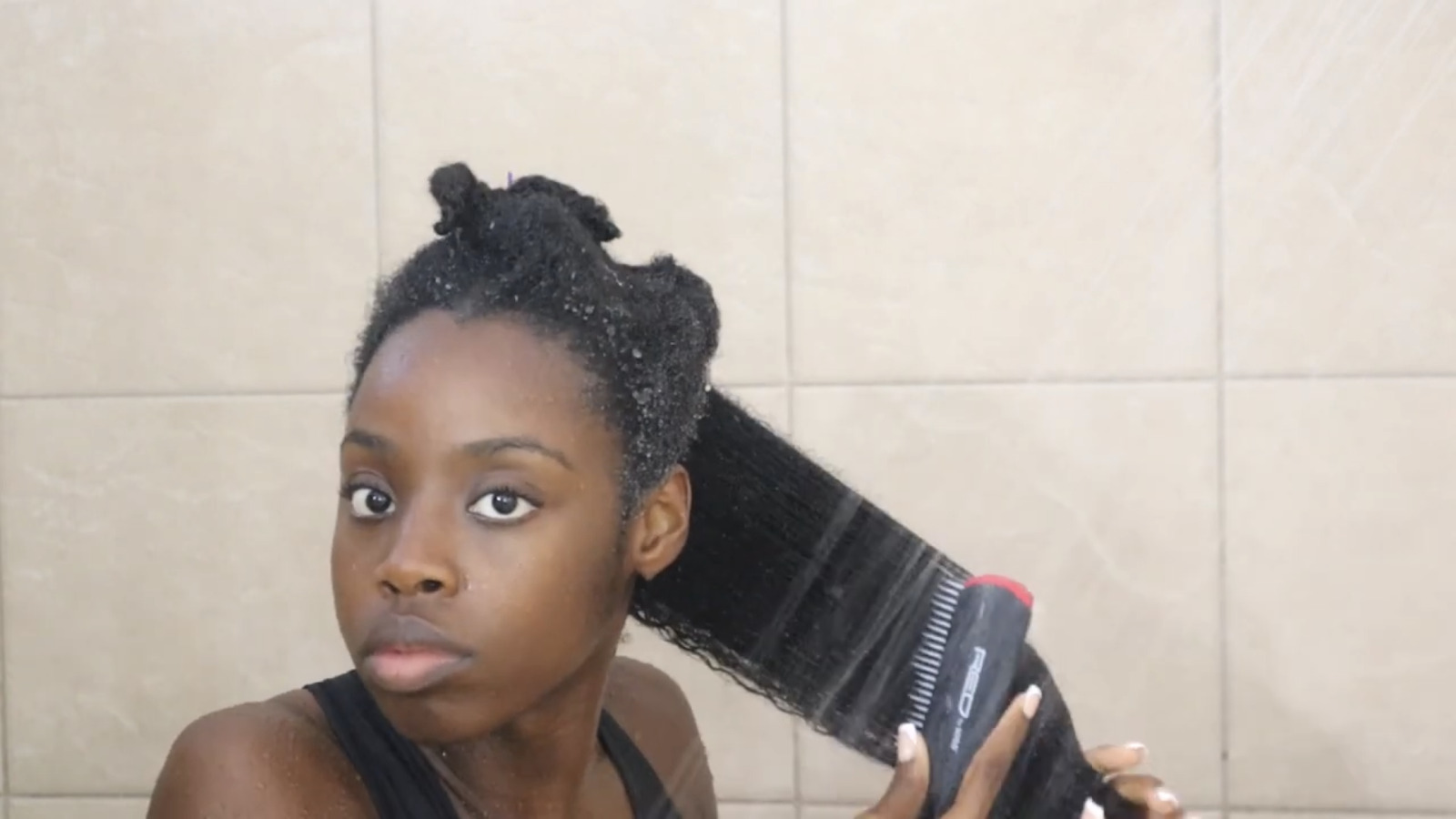Rinse hair with water, apply shampoo, lather, and rinse again. Then apply conditioner and use a brush to detangle the hair