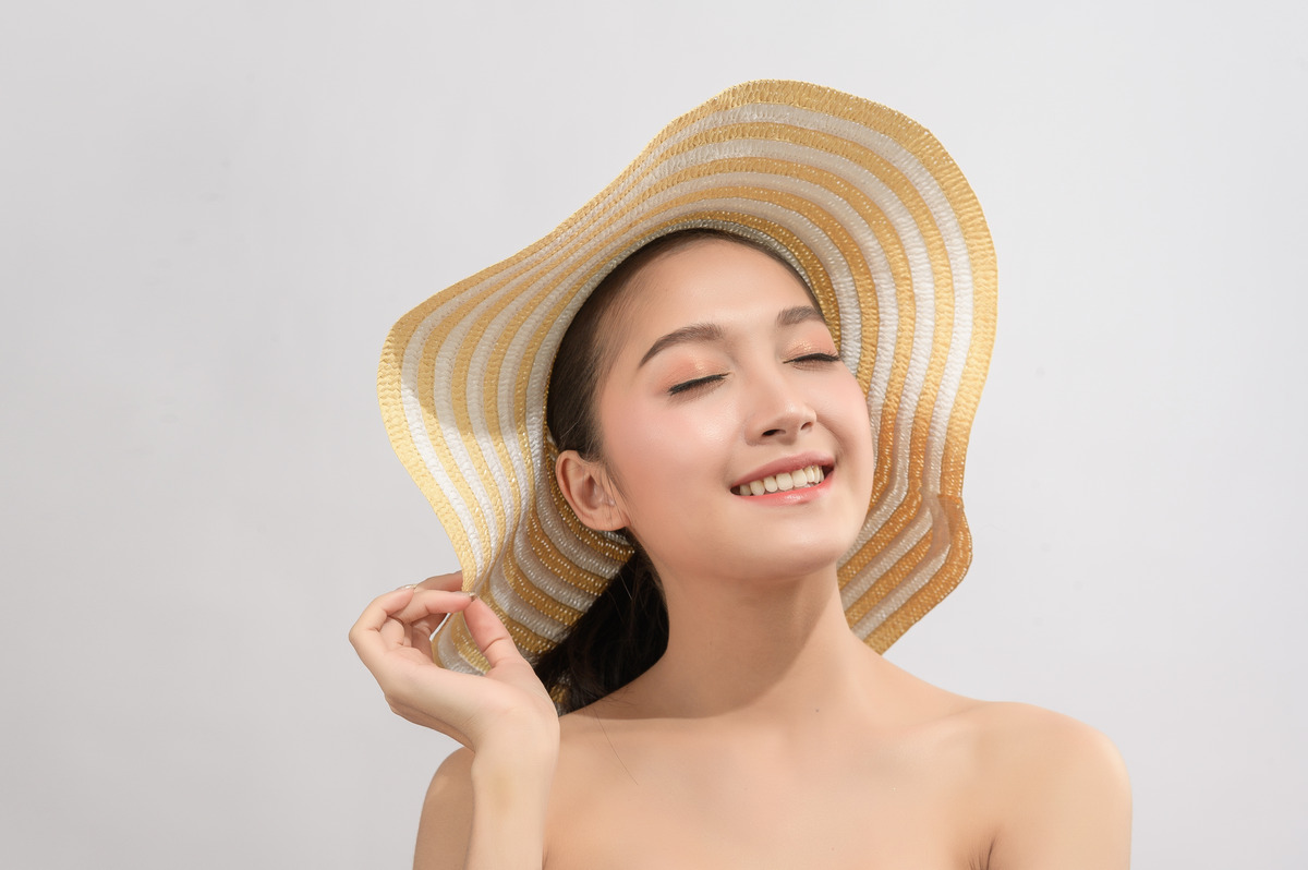 Cover your hair with a wide-brimmed hat