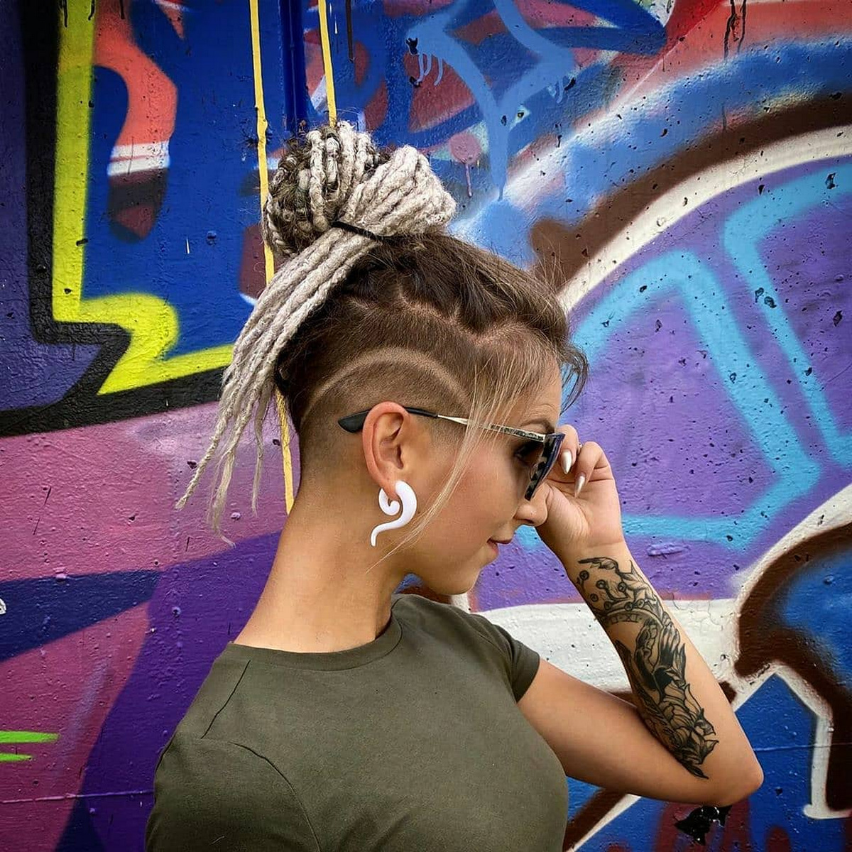 Dreadlocks And Top Knot With Undercut Design