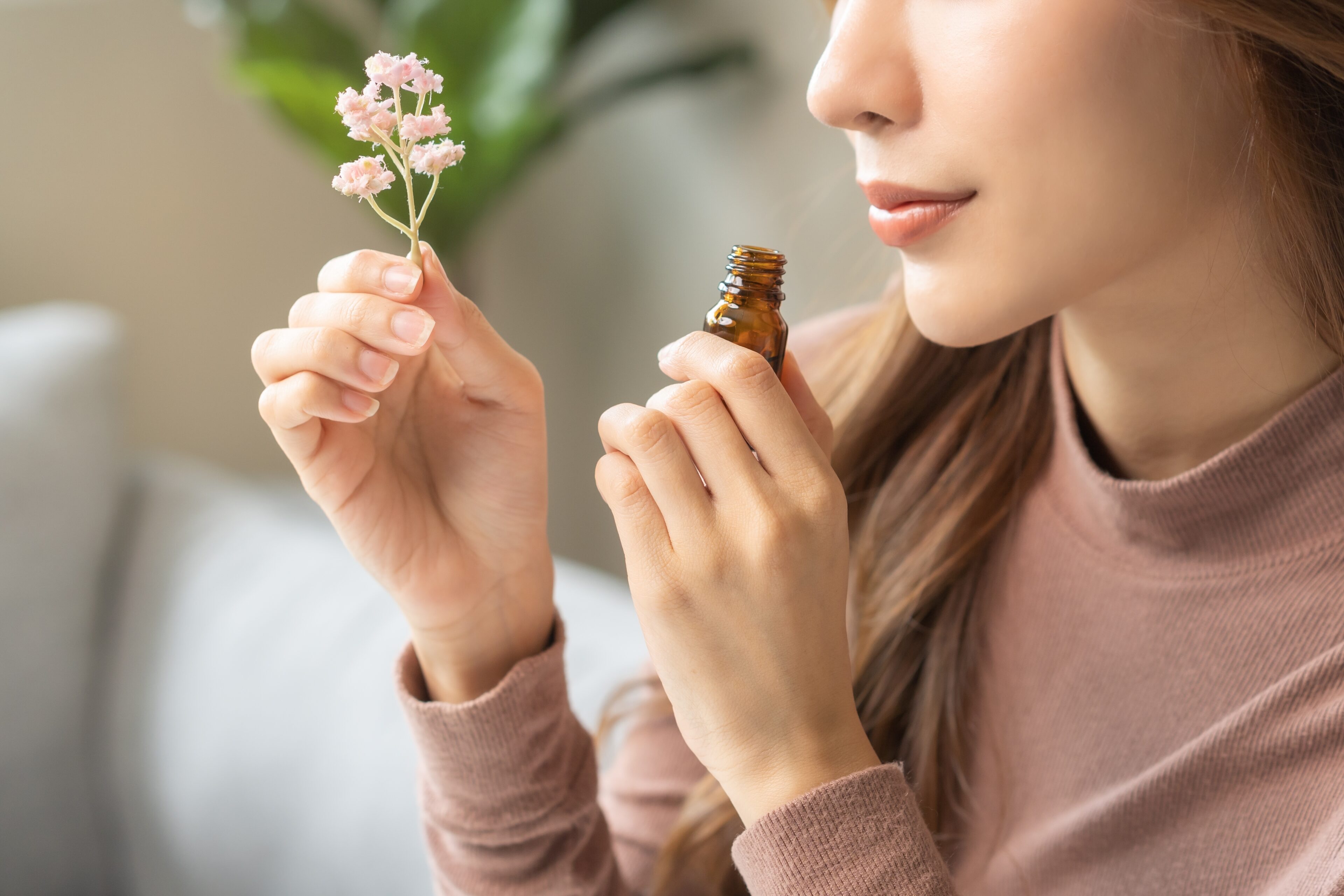 A woman smelling a product