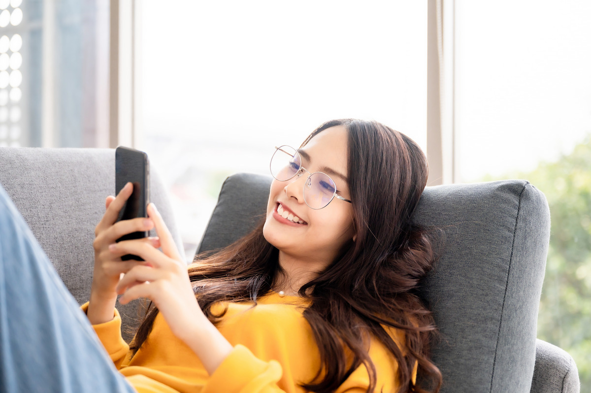 Girl reading user manual on phone