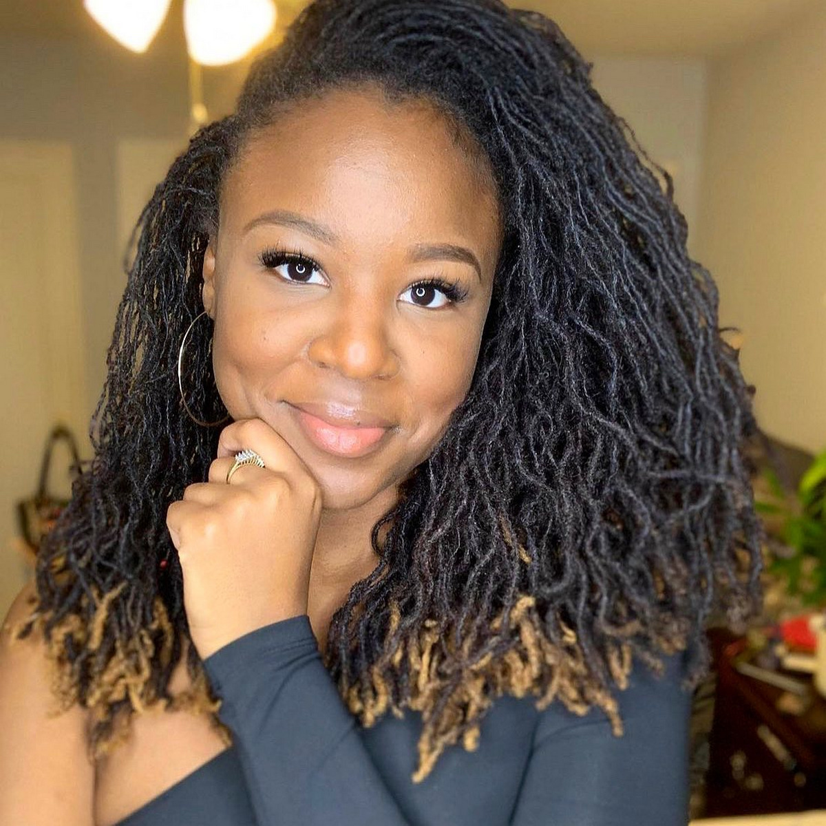 Girl with curly hair and dreads style