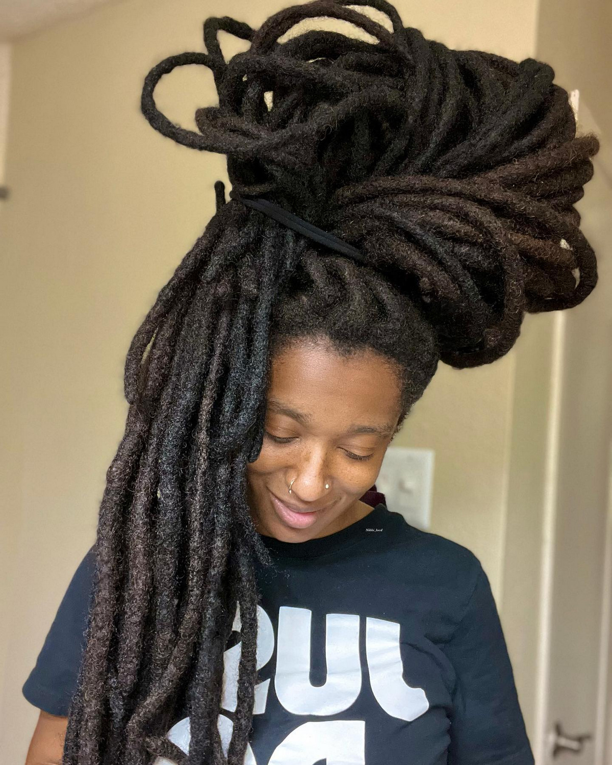 Girl with fast growing dreadlocks