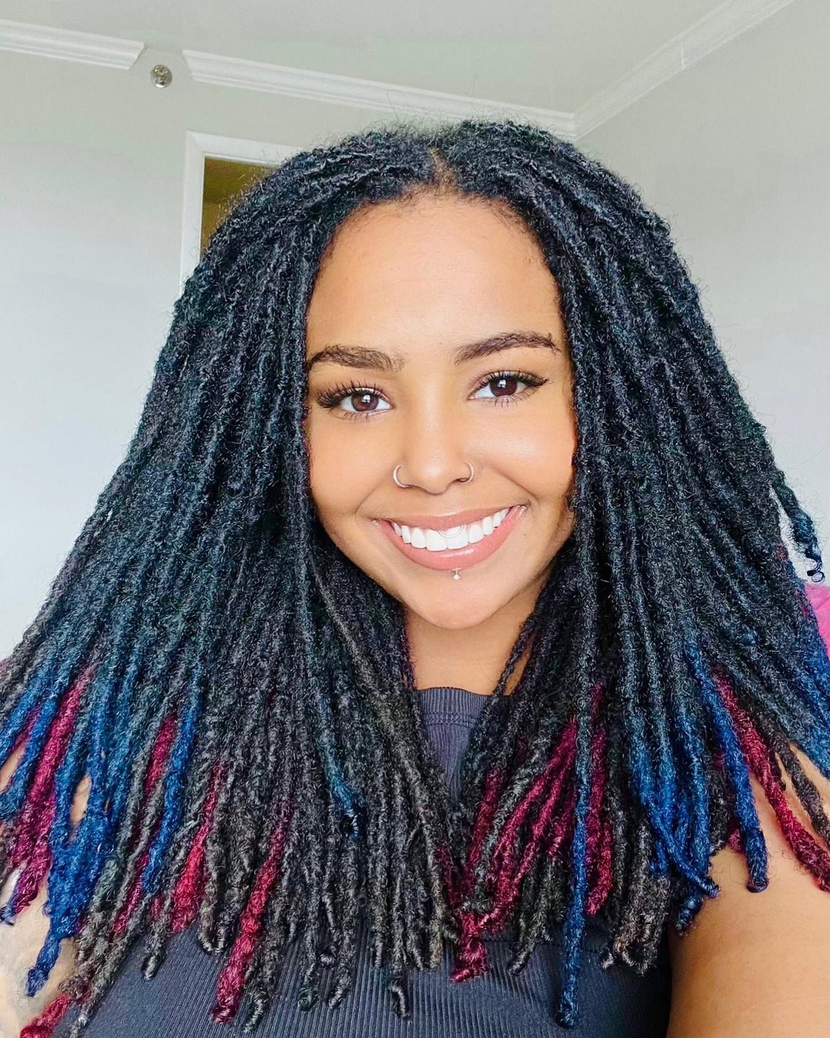 Girl with moderate growing dreadlocks