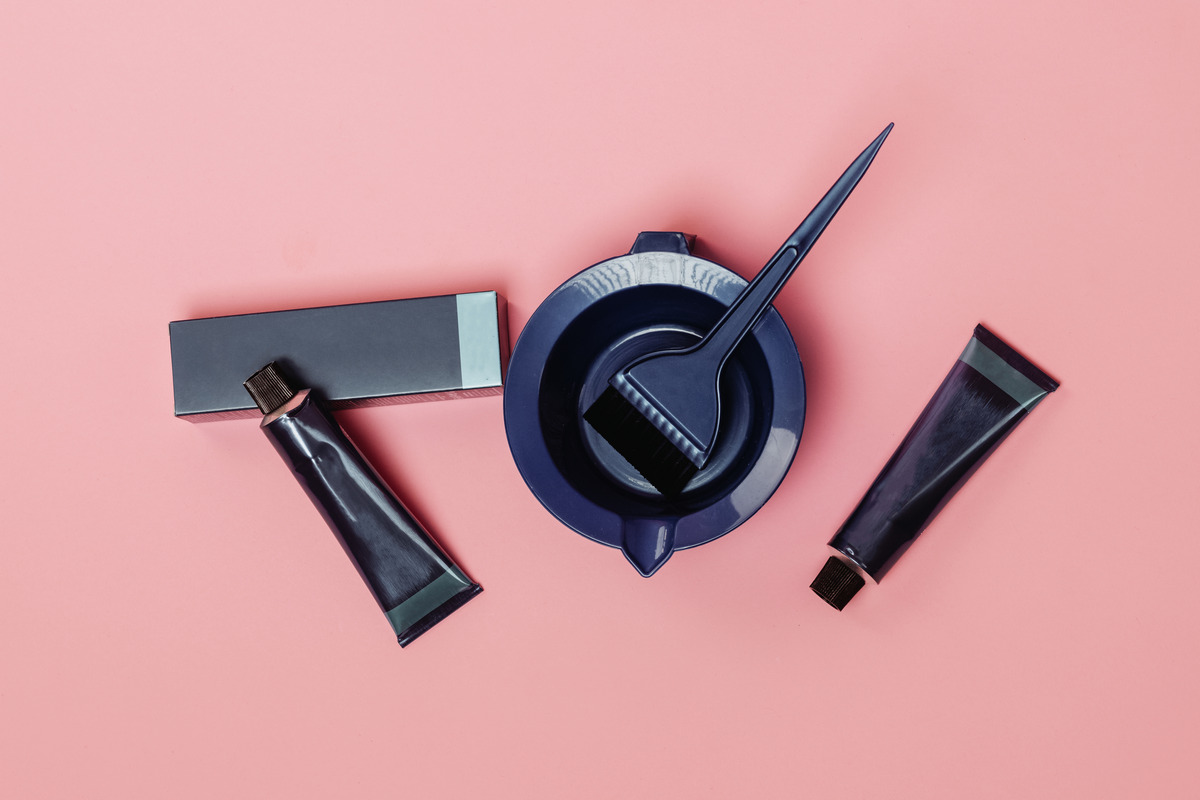 Hair dye and a brush with a plate