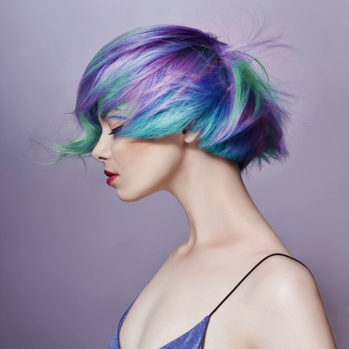 Portrait of a woman with light colored bouncy hair