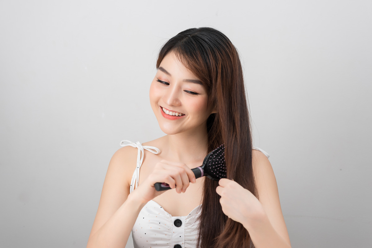 Using Wide-Toothed Comb For Hair