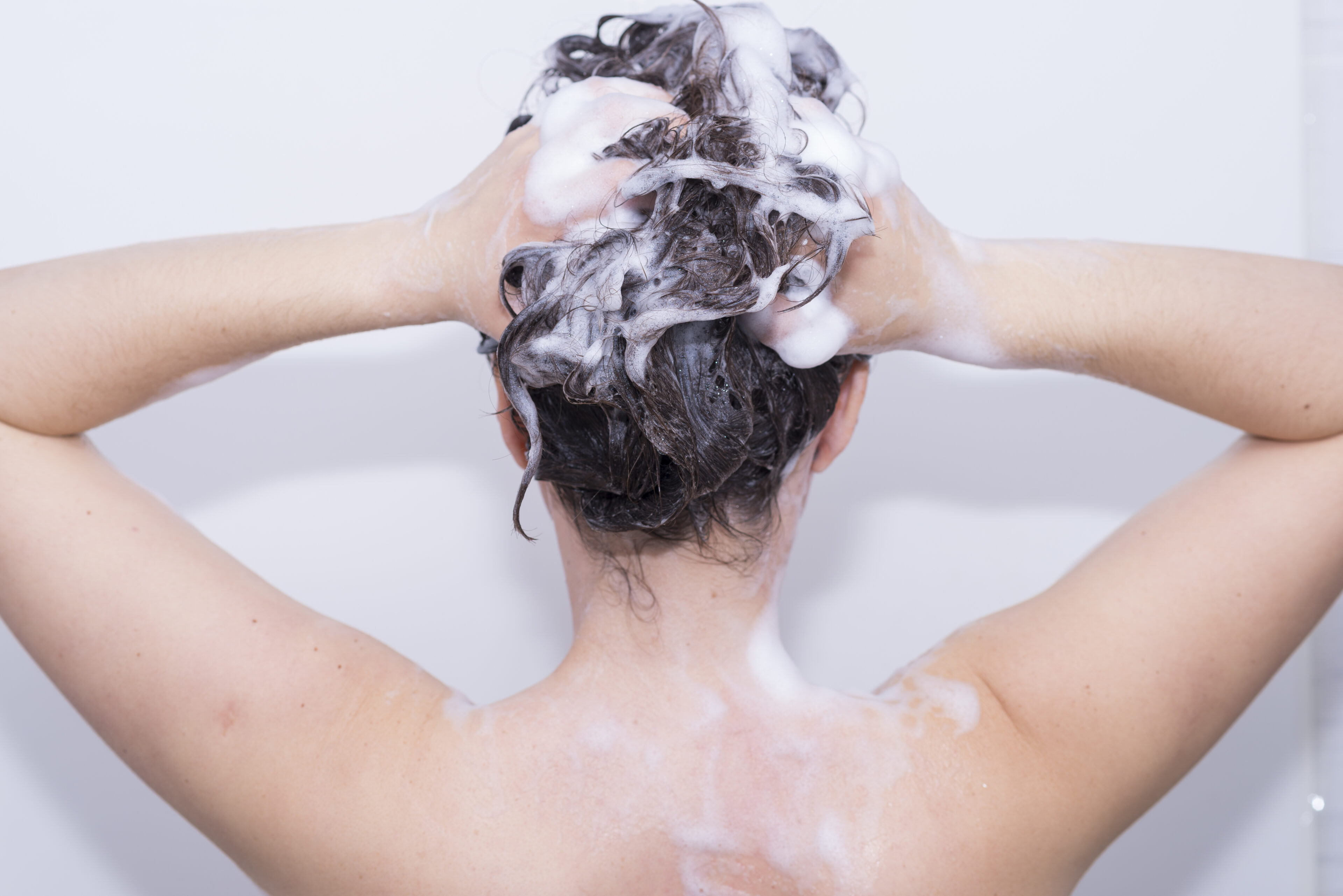 Wash your hair less frequently