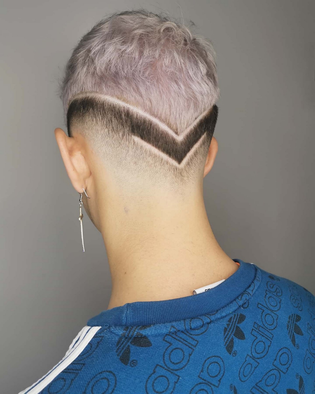 Creative confidence with haircut lines in the back with fade