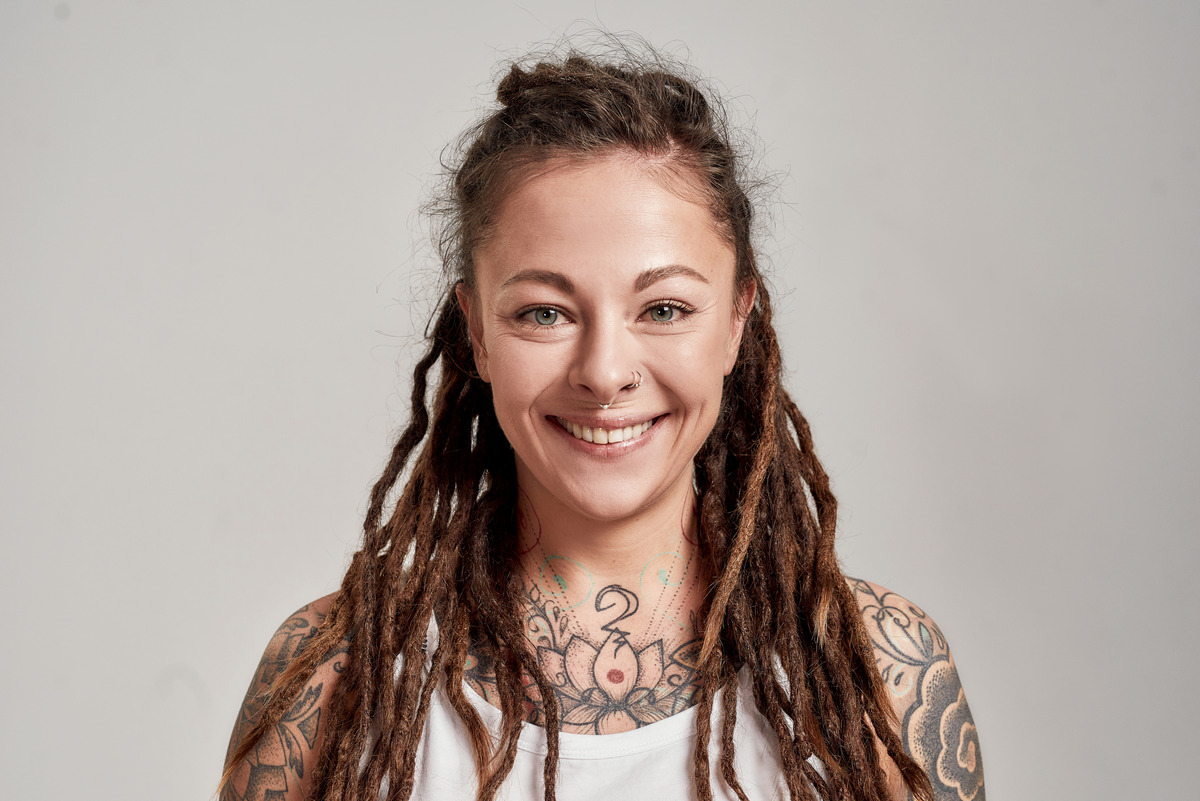 Young woman with dreadlocks wearing a white shirt