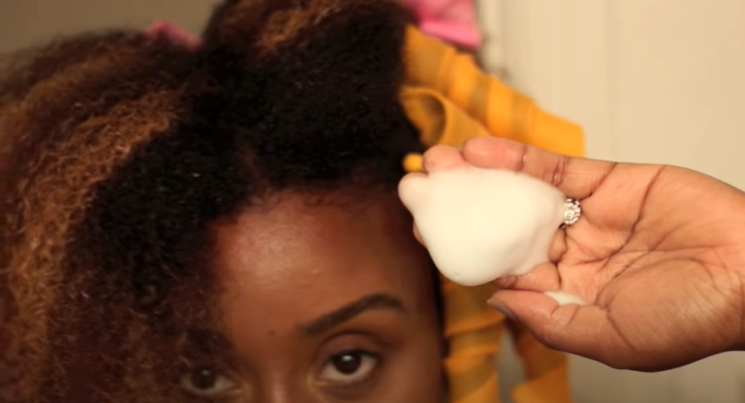  Apply a small amount of styling gel or curling cream 