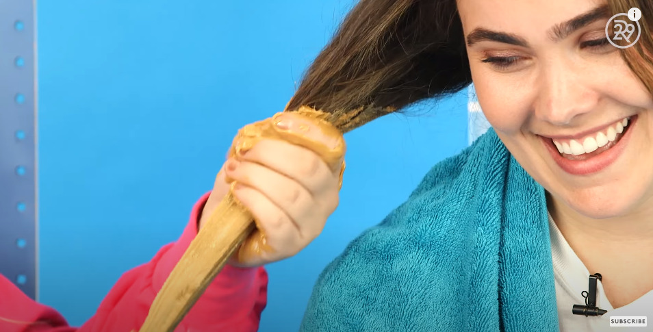 They are using peanut butter for hair
